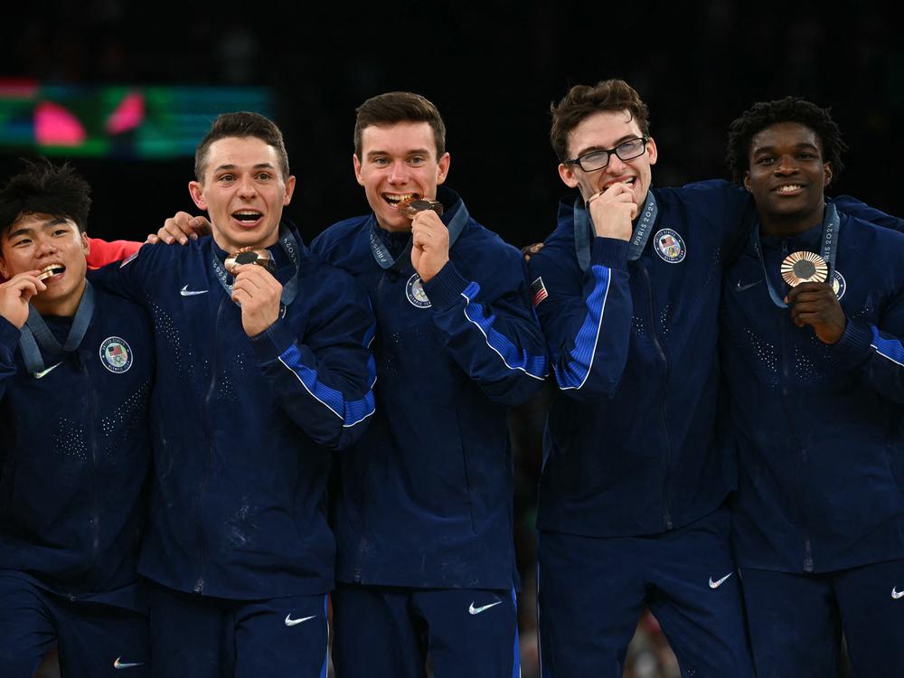 Members of the U.S. men's gymnastics team pose with their bronze medal following the men's team final on Monday. It's the first Olympic medal for the U.S. in the event since 2008.