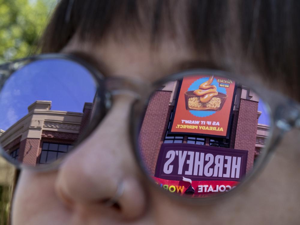 The entrance to Hershey's Chocolate World in Hershey, Pa., is reflected in Domonoske's sunglasses.