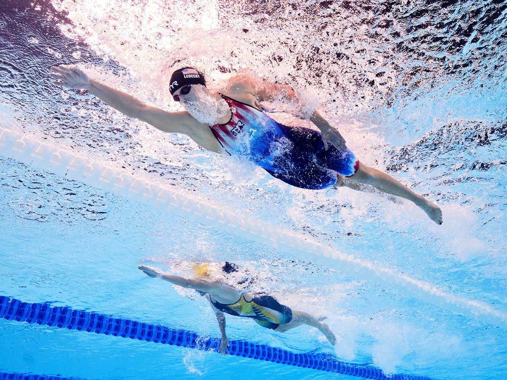 Katie Ledecky, top, stays ahead of Ariarne Titmus of Team Australia in the Women's 800m Freestyle Final on Saturday. Ledecky never relinquished the lead and won her ninth Olympic gold medal.