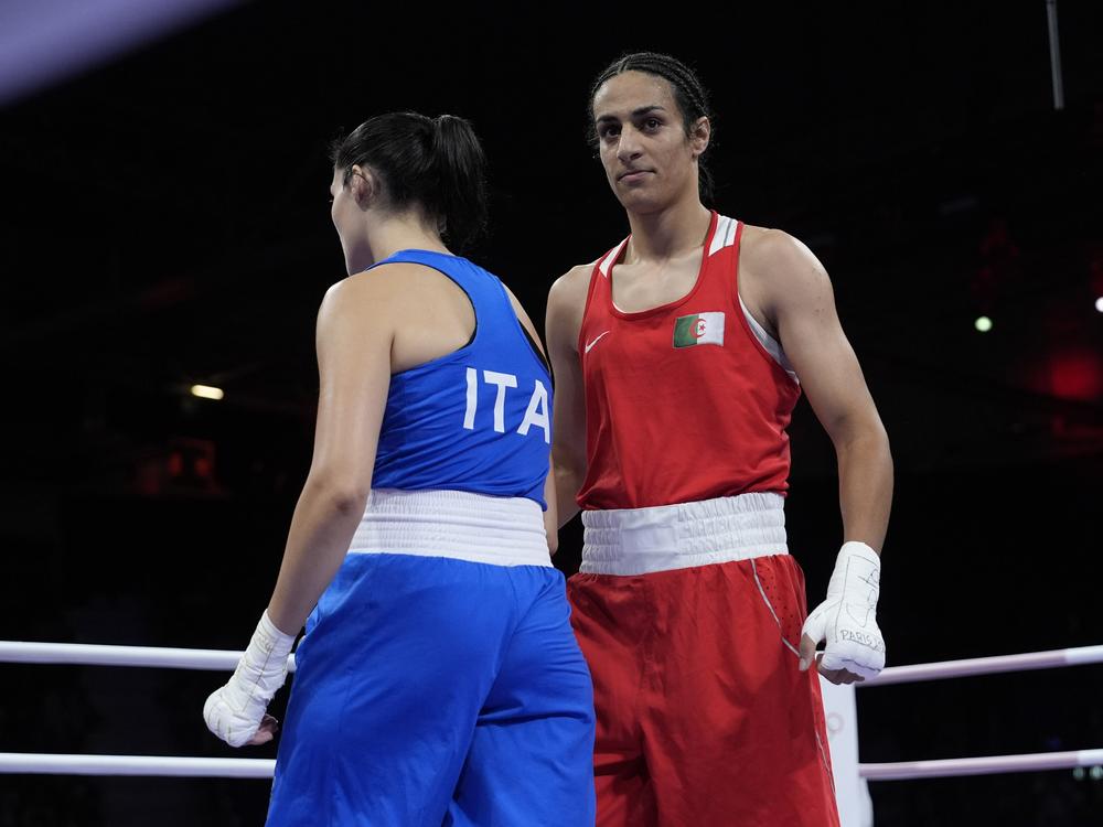 Algeria's Imane Khelif, right, walks beside Italy's Angela Carini after winning their women's 66kg preliminary boxing match on Thursday.