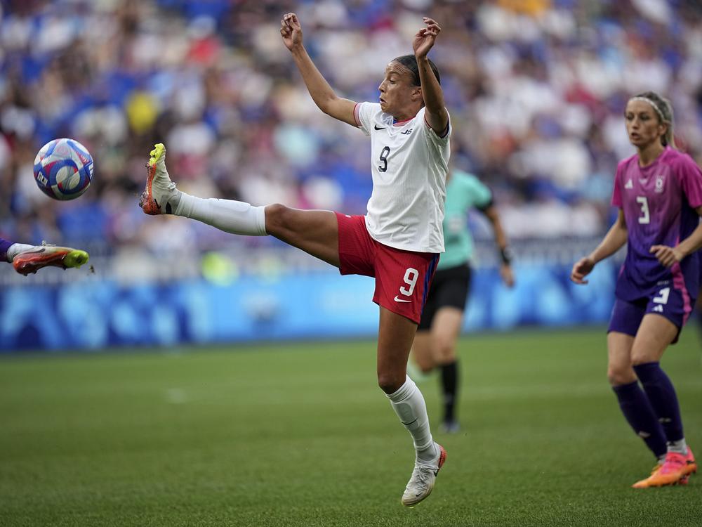 The U.S. women's soccer team defeated Germany 1-0 to advance to its first gold medal match at the Olympics since 2012. The U.S. team's Mallory Swanson fights for the ball during the semifinal match on Tuesday at Lyon Stadium in Decines, France.