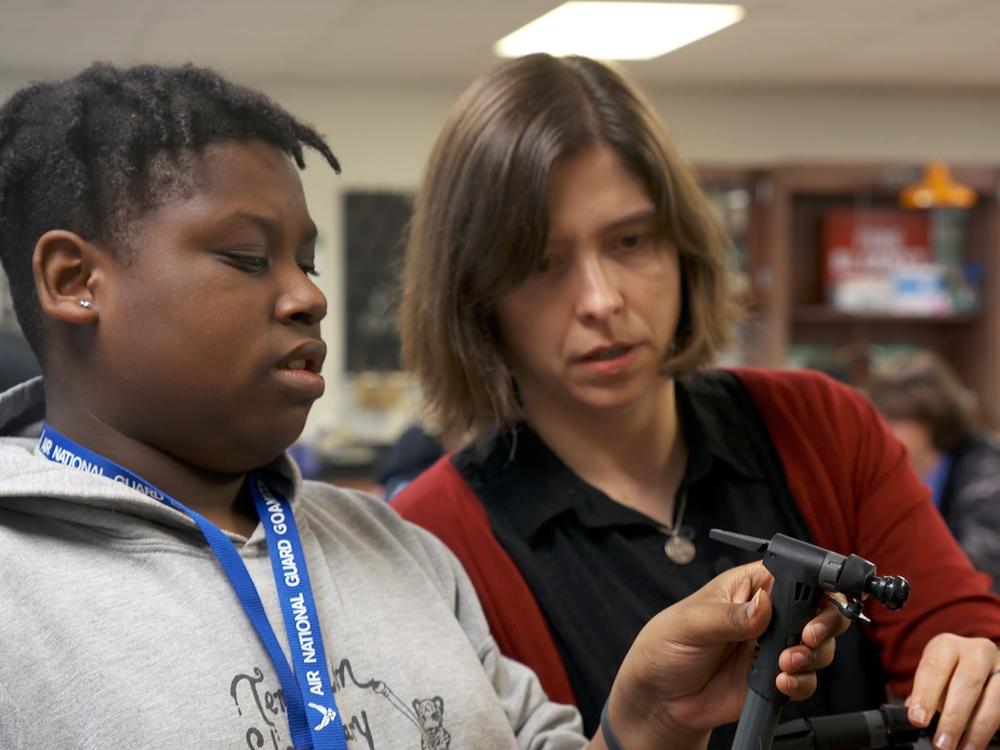 High school freshman DeWayne Murphy consults with Milks, his science teacher, on a classroom experiment.