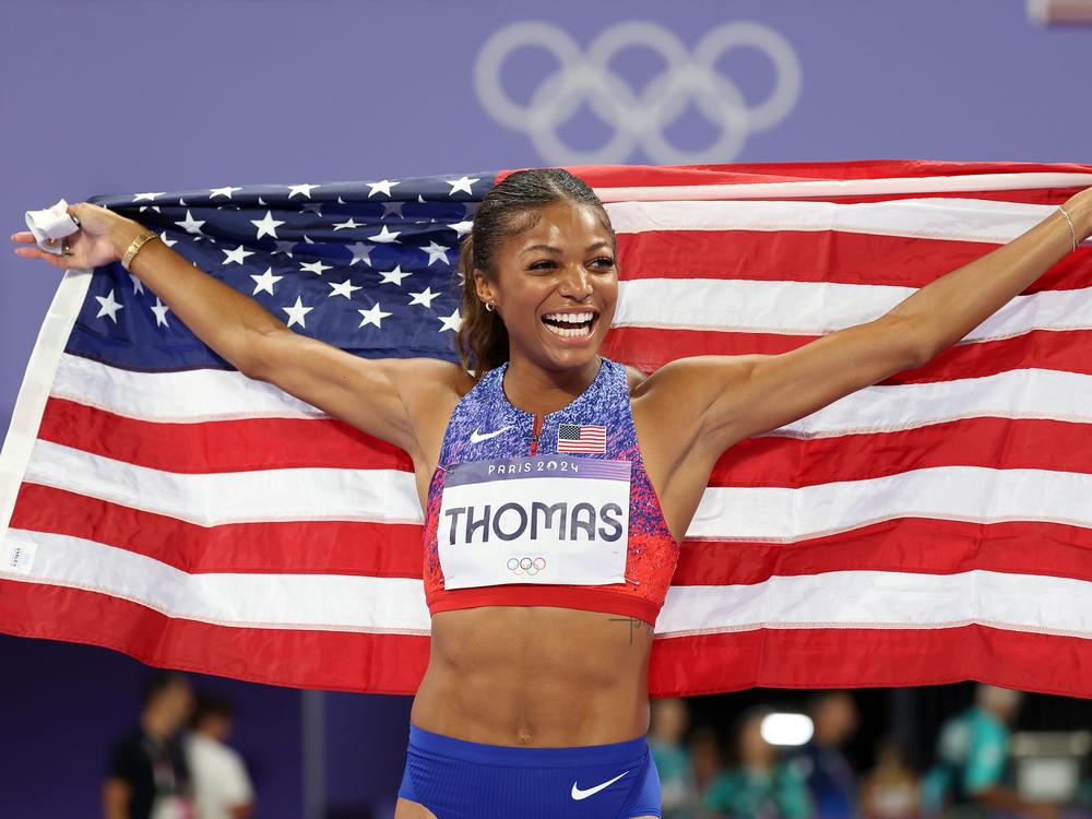 Sprinter Gabby Thomas of the U.S. celebrates winning the gold medal after competing in the women's 200m final on Tuesday at the Paris Olympic Games at Stade de France.