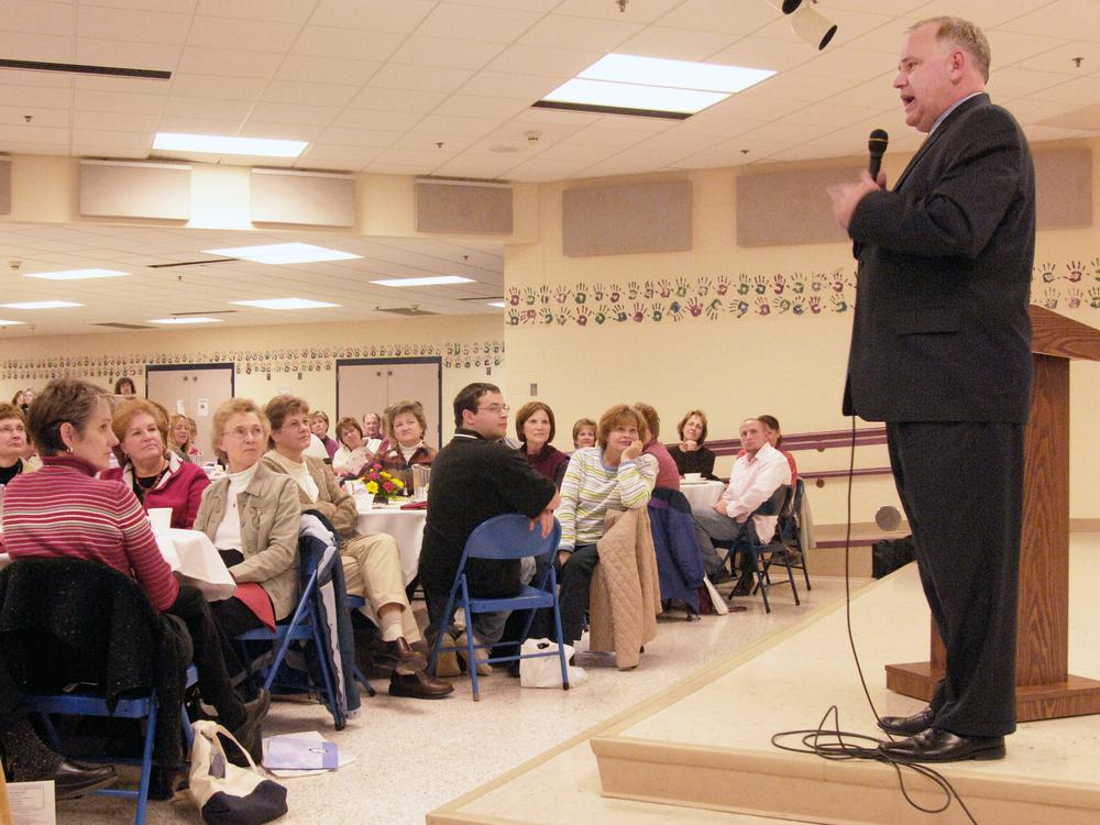 Then-Democratic congressional candidate Tim Walz talks with a teachers group during a campaign stop in Mankato, Minn., on Oct. 25, 2006.