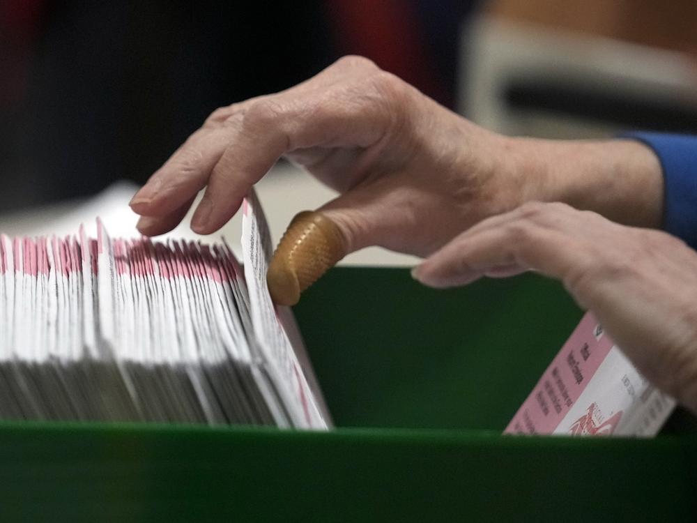 An election worker processes ballots at the Clark County Election Department in Las Vegas on Nov. 10, 2022.