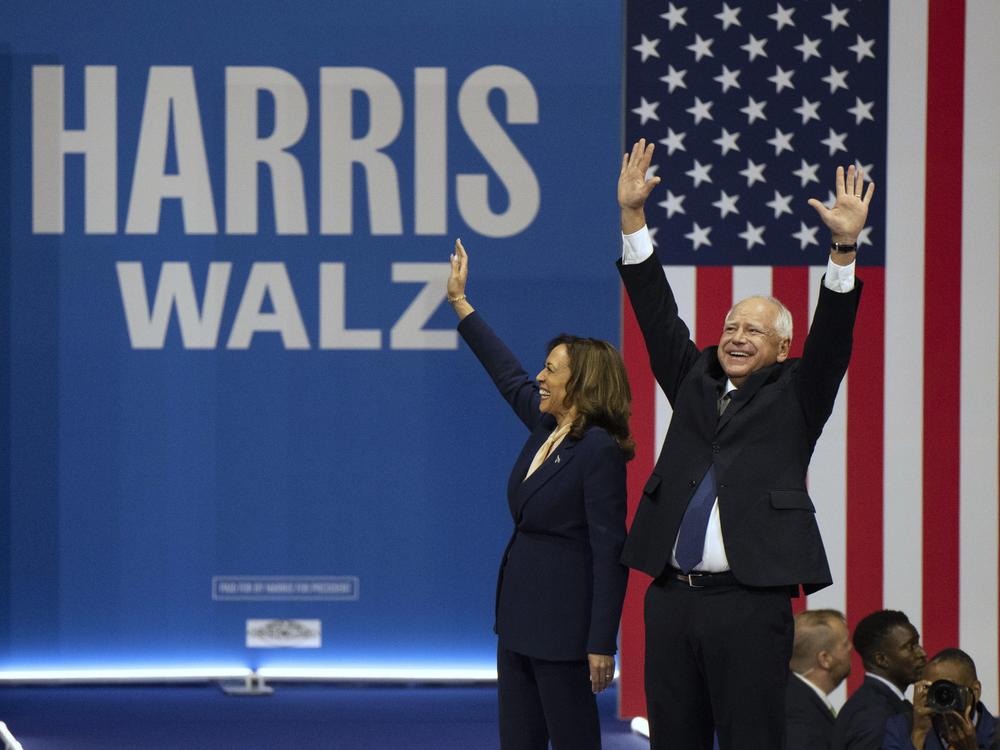 Vice President Harris, the Democratic presidential nominee, and her running mate, Minnesota Gov. Tim Walz, arrive for a campaign rally in Philadelphia Tuesday.