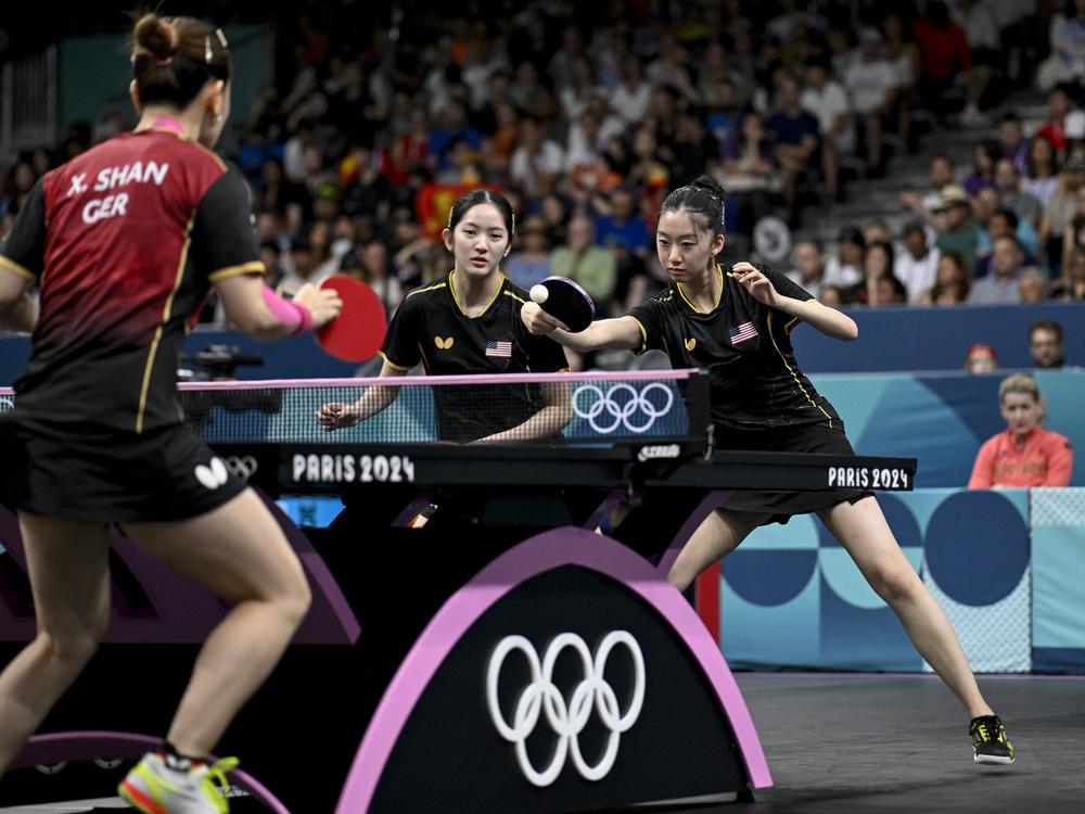 Rachel Sung and Amy Wang of the U.S. women's table tennis team take on Germany during the 2024 Olympic Games in Paris. 