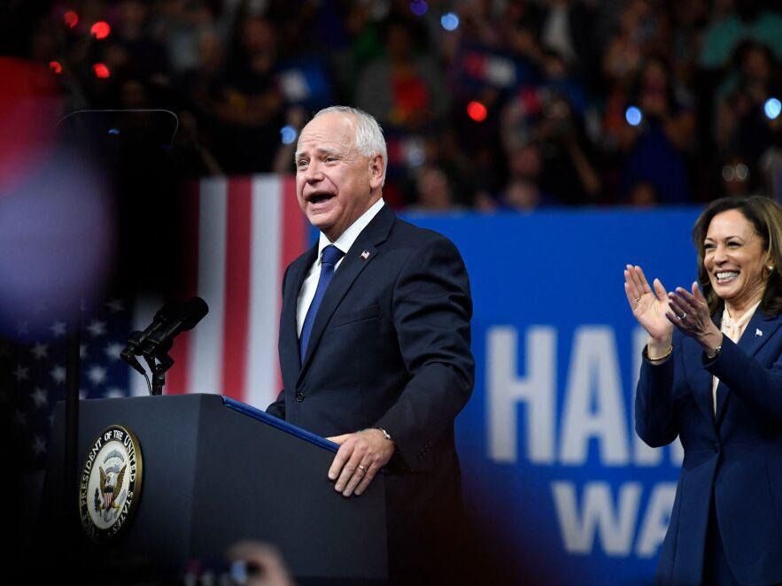 Vice President and Democratic presidential nominee Kamala Harris applauds as her running mate, Minnesota Gov. Tim Walz, speaks at Temple University's Liacouras Center in Philadelphia on Tuesday. 