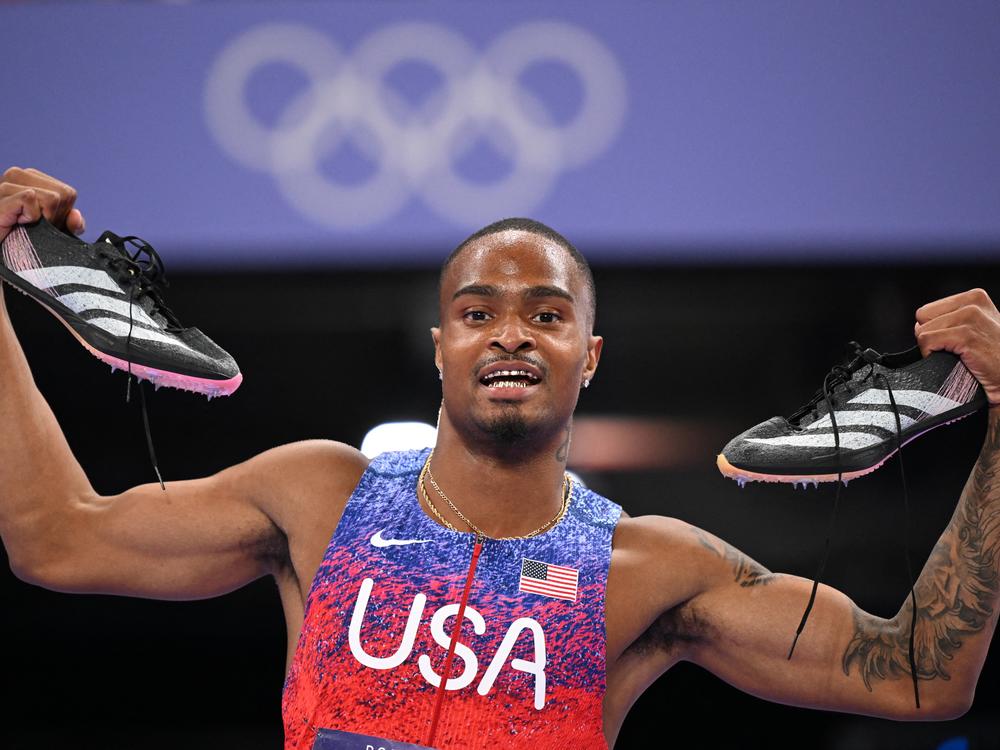 Quincy Hall celebrates winning the gold medal for the U.S. after competing in the Men's 400m final on Wednesday at Stade de France at the Paris Summer Olympics.