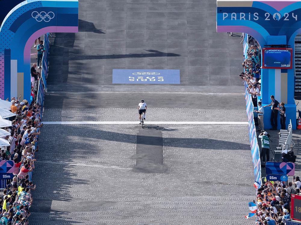 Kristen Faulkner passes the finish line during the women's road race of cycling on Aug. 4, 2024.