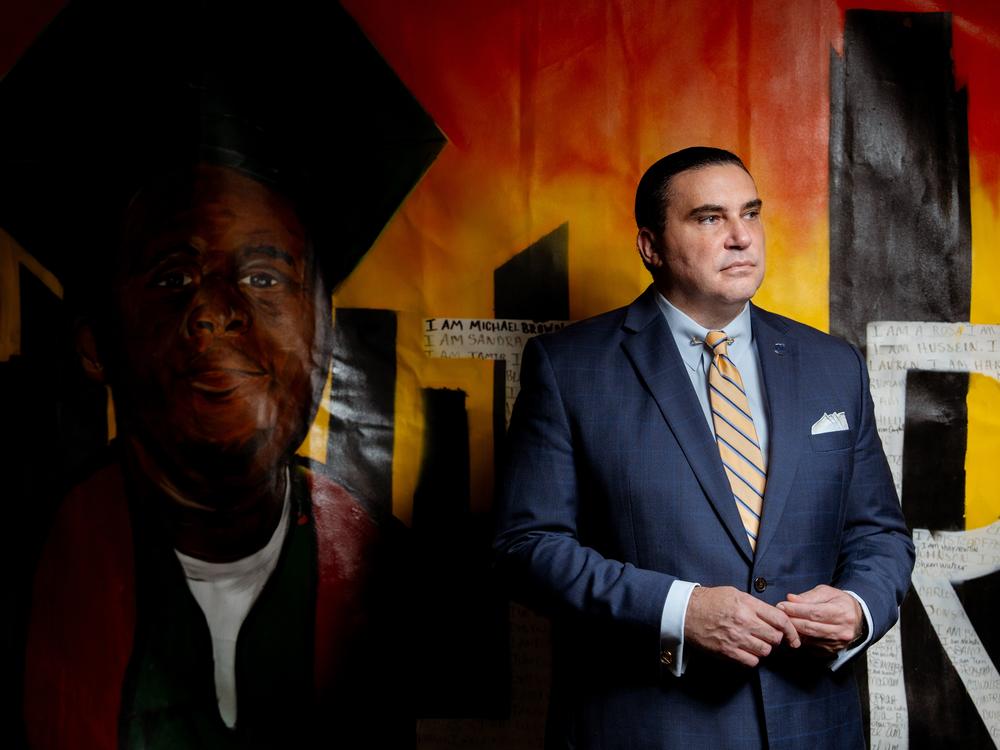 Michael McMillan, the president and CEO of Urban League St. Louis, stands in front of a painting of Michael Brown Jr. on Tuesday, Aug. 6, 2024, at the Ferguson Empowerment Center in Ferguson. The Urban League and Salvation Army built the community center at the site where a QuickTrip burned down in 2014 after the police killing of Brown Jr.