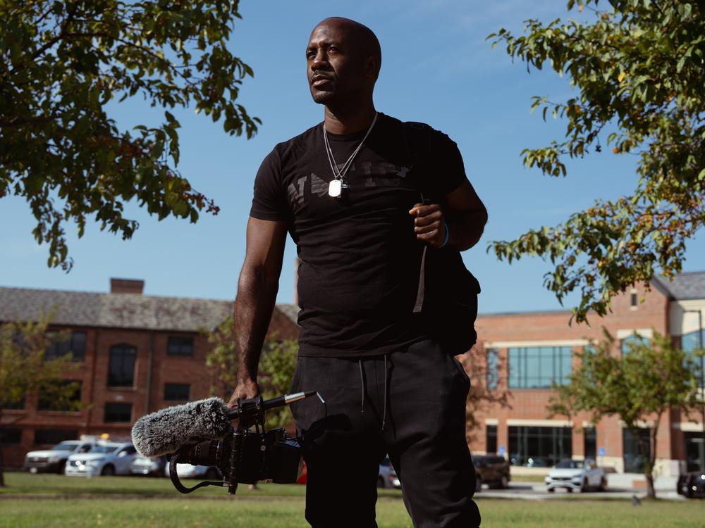 Filmmaker Chris Phillips on Friday, Aug. 9, 2024, before a unity march commemorating a decade after Michael Brown Jr.’s police killing in Ferguson. Phillips has been documenting the Ferguson community since 2014.