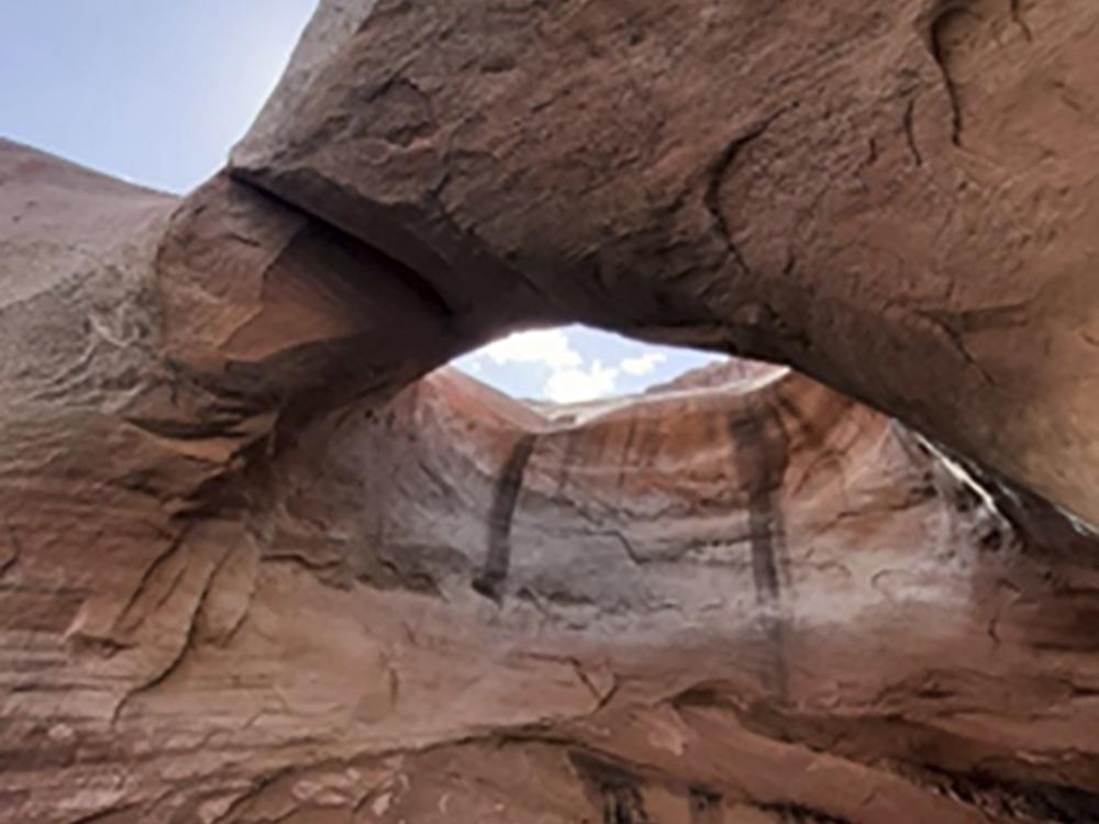 This undated photo provided by the National Park Service shows Double Arch before it collapsed in Rock Creek Bay, part of the Glen Canyon National Recreation Area in Utah, last week.