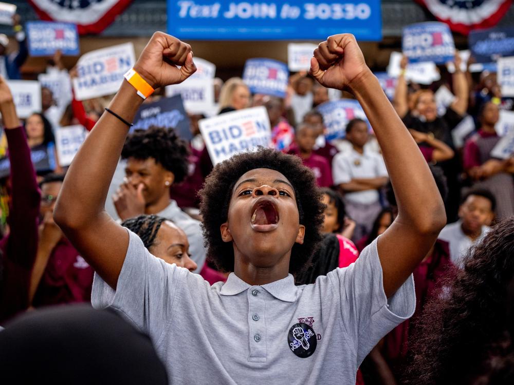 A member of the audience cheers as President Biden speaks during a campaign rally at Girard College on May 29 in Philadelphia. Biden has since dropped out of the race in favor of Vice President Harris and this event launched a nationwide campaign to court Black voters, a group that has traditionally come out in favor of Biden, but their support projected lower for him than it was in 2020. Harris' stake with the group is yet to be seen. 