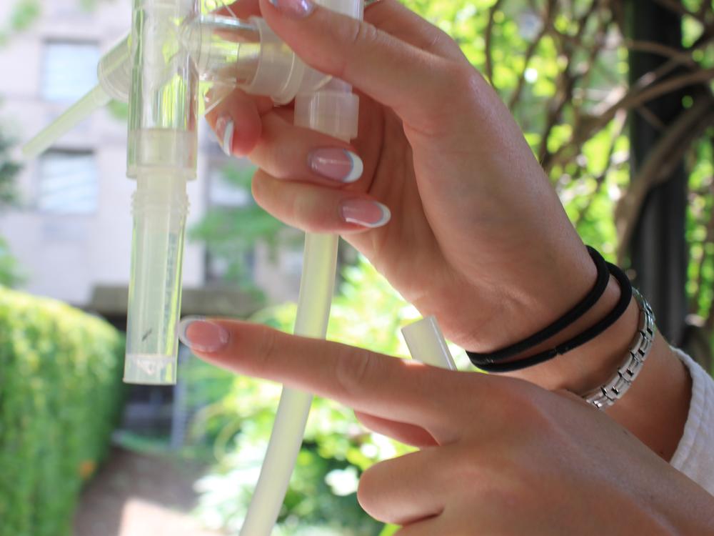 Fordham University student Clancy McCann shows off a ManhattAnt that she captured for research, from a nest conveniently located on the school’s plaza.<br>