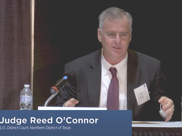 U.S. Federal Judge Reed O'Connor has been a longtime active member of the Federalist Society. In 2018, he spoke on a panel at the annual Texas Chapters Conference.<br>