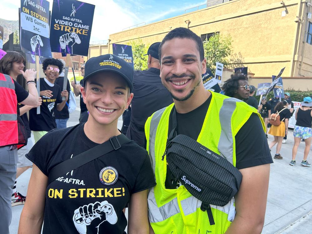  Andi Norris (left) and Jasiri Booker (right) picketing outside Warner Bros. Studios in early August. 