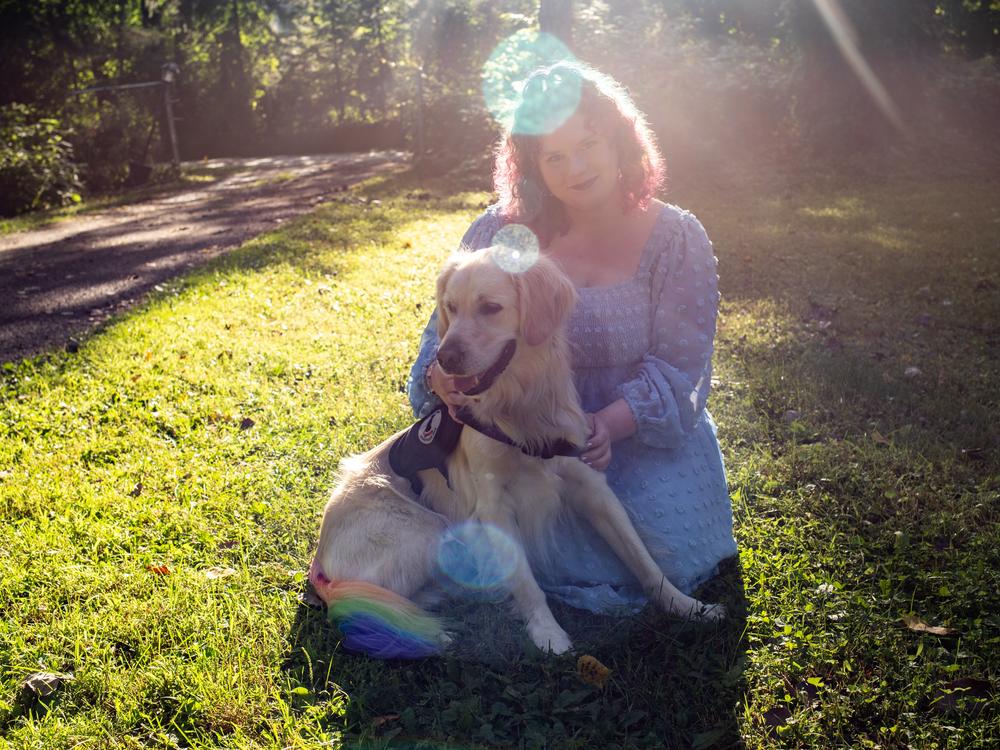 Lilla Lanivich, 14, and her service dog, Lopez, outside their family’s home in Rochester Hills, Mich. This year’s middle school winner of the NPR Student Podcast Challenge tells how her golden retriever, Lopez, helped restore her independence.