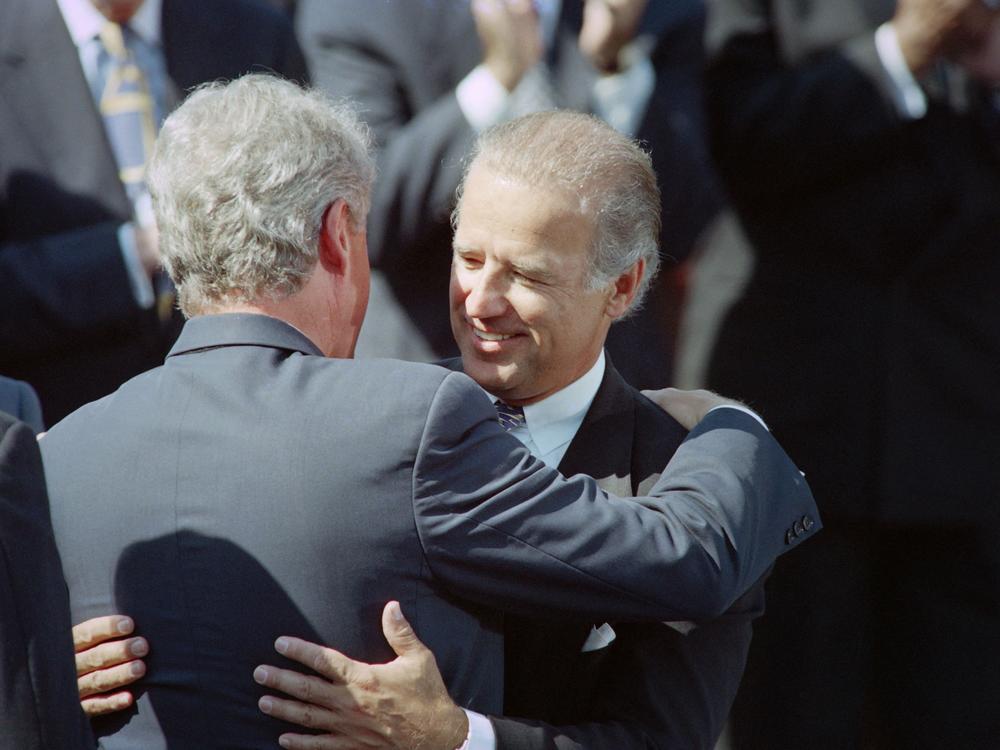 Then-President Bill Clinton (left) hugs then-Sen. Joe Biden on Sept. 13, 1994, during a signing ceremony for the crime bill on the South Lawn of the White House.