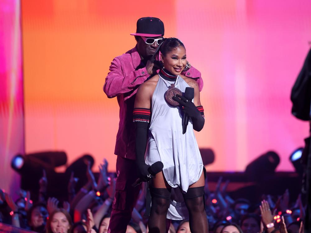 (L-R) Flavor Flav and Jordan Chiles speak on stage during the 2024 MTV Video Music Awards at UBS Arena on Sep. 11, 2024 in Elmont, New York.