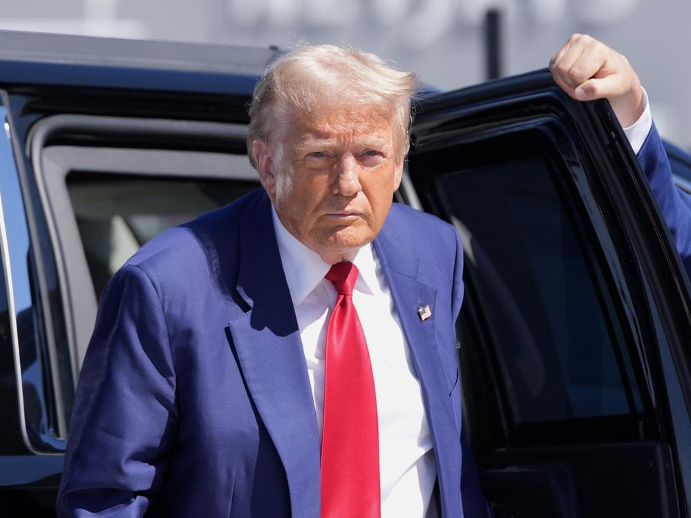 Republican presidential nominee, former President Donald Trump, arrives at Harry Reid International Airport to board a plane after a campaign trip on Saturday in Las Vegas.