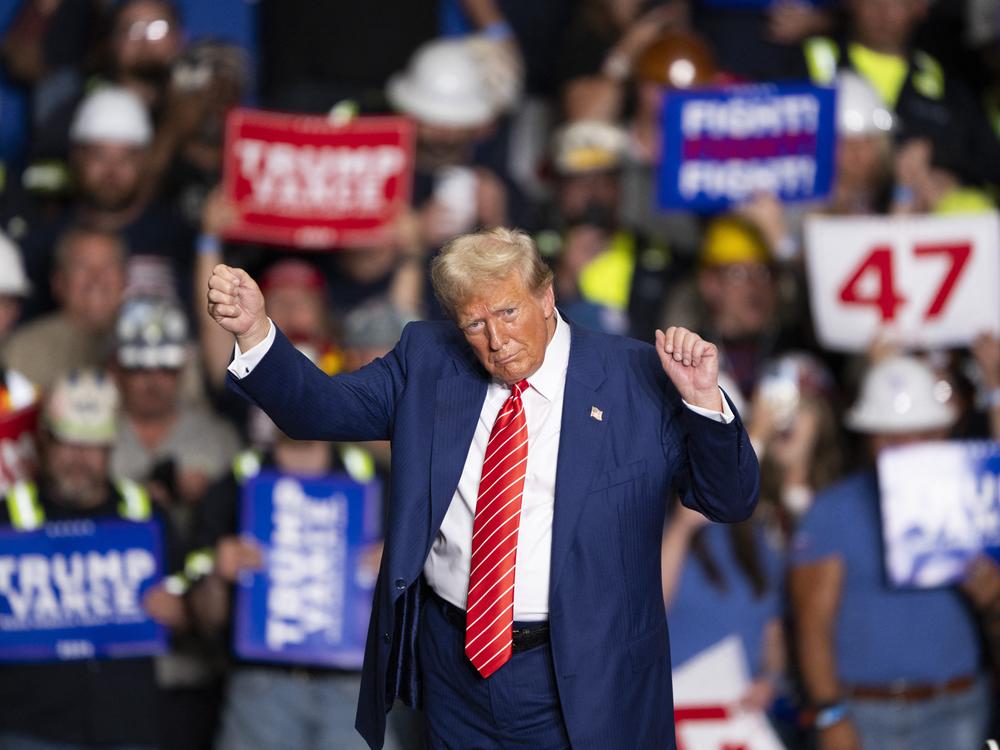 Former President Donald Trump dances to a song as he leaves a rally in Johnstown, Pa., on Aug. 30.