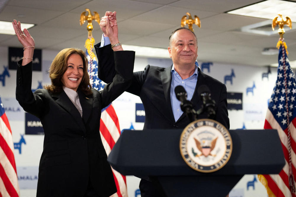 U.S. Vice President Kamala Harris and second gentleman Douglas Emhoff gesture at Kamala's Presidential Campaign headquarters in Wilmington, DE, U.S., July 22, 2024. Photo by Erin Schaff/Pool via REUTERS