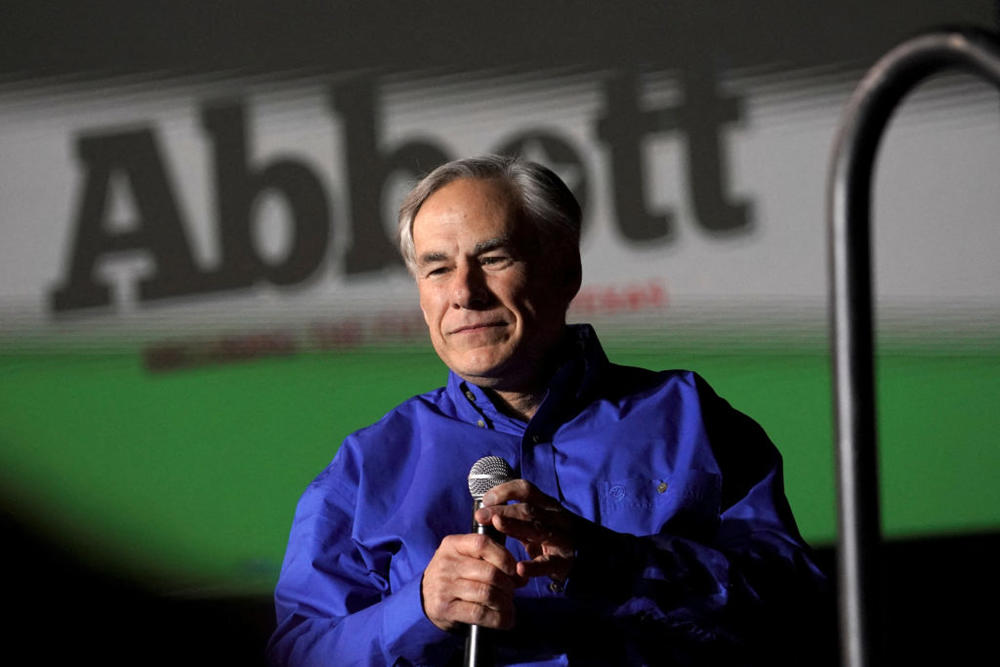 FILE PHOTO: Republican Texas Governor Greg Abbott running for re-election as Governor of Texas in the 2022 U.S. midterm elections, speaks during a rally, in Conroe, Texas, U.S., January 29, 2022. REUTERS/Go Nakamura/File Photo