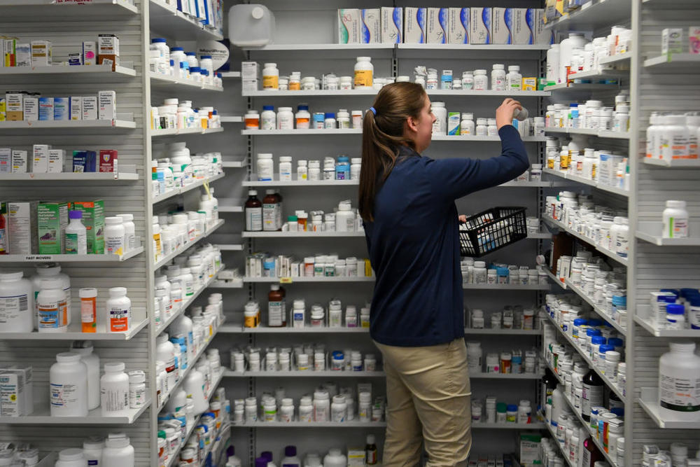 A technician stocks the shelves of the pharmacy at White House Clinic in Berea, Kentucky, U.S., February 7, 2018. Picture taken February 7, 2018. REUTERS/Bryan Woolston