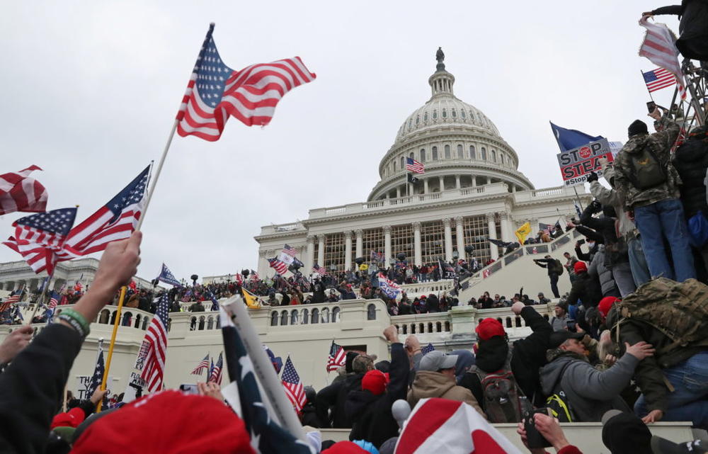 A mob of supporters of then-President Donald Trump storm the U.S. Capitol Building in Washington, D.C., Jan. 6, 2021. Photo by Leah Millis/REUTERS