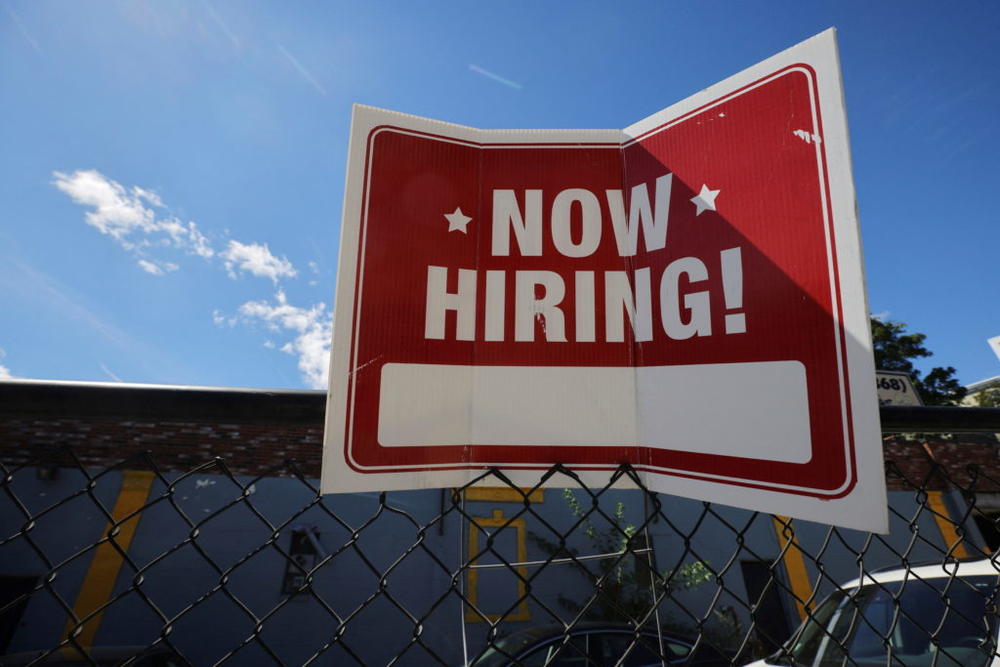 A "now hiring" sign is displayed outside Taylor Party and Equipment Rentals in Somerville, Massachusetts, U.S., Sept. 1, 2022. Photo by Brian Snyder/Reuters