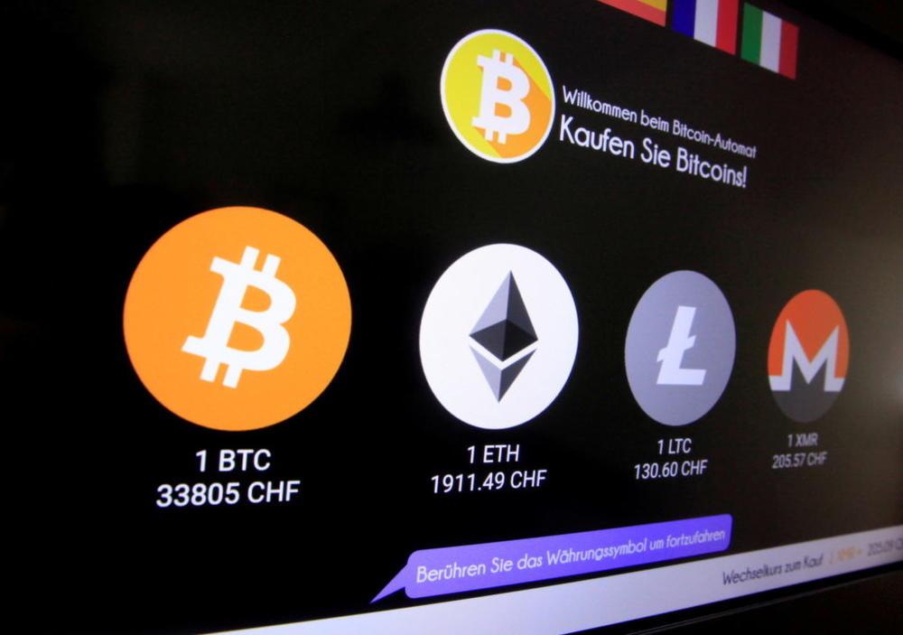 The exchange rates and logos of Bitcoin (BTH), Ether (ETH), Litecoin (LTC) and Monero (XMR) are seen on the display of a cryptocurrency ATM of blockchain payment service provider Bity at the House of Satoshi bitcoin and blockchain shop in Zurich, Switzerland June 25, 2021. Photo by Arnd Wiegmann/REUTERS