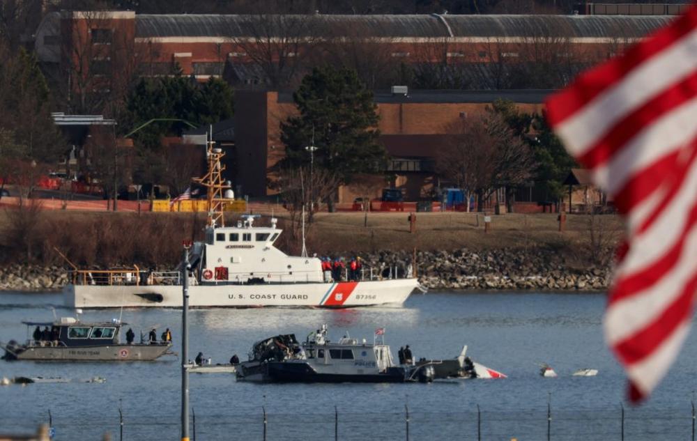 Search and rescue teams work near the Ronald Reagan Washington National Airport, in the aftermath of the collision of American Eagle flight 5342 and a Black Hawk helicopter that crashed into the Potomac River, in Arlington, Virginia, U.S., January 30, 2025. REUTERS/Evelyn Hockstein