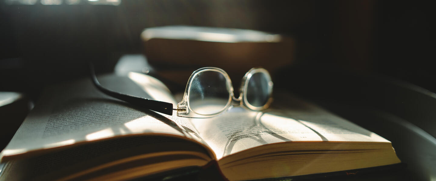 glasses on a dictionary