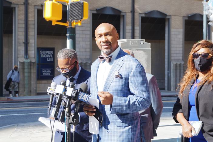 Secoriea Turner's family attorney Mawuli Davis addresses the media in October regarding the Bozeman Law Firm's intent to sue the city of Atlanta.