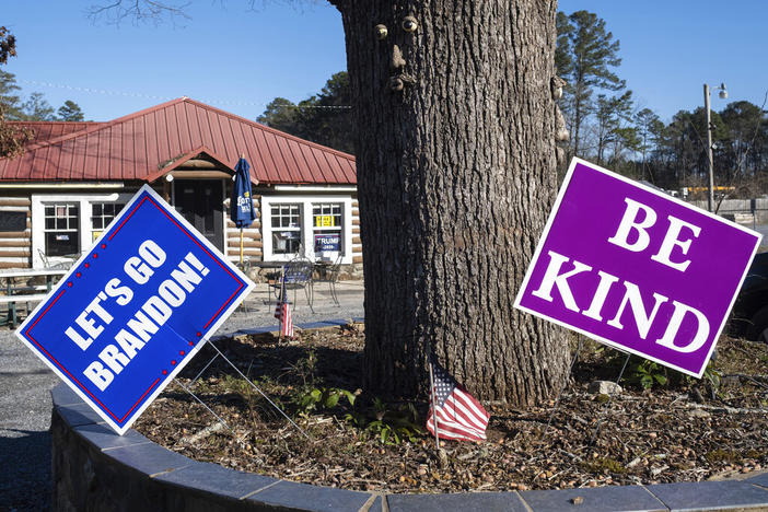 An anti-Biden sign is displayed outside the Ole Tymer BBQ restaurant in Rome, Ga., on Saturday, Feb. 5, 2022, in Georgia's 14th congressional district. Georgia will hold its Republican primary on May 24. 