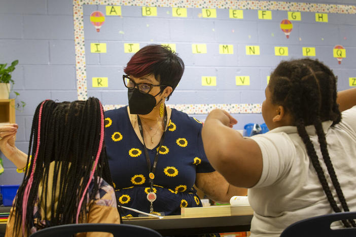 Third-grade students take part in a small group reading session at Beecher Hills Elementary School on Friday, Aug. 19, 2022, in Atlanta. Mounting evidence shows that students who took part in remote learning during the coronavirus pandemic lost about half of an academic year of learning.