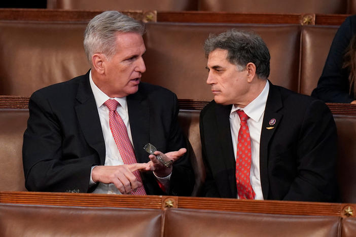 Rep. Kevin McCarthy, R-Calif., left, talks with Rep. Andrew Clyde, R-Ga., after a failed seventh vote in the House chamber as the House meets for the third day to elect a speaker and convene the 118th Congress in Washington, Thursday, Jan. 5, 2023. (AP Photo/Alex Brandon)