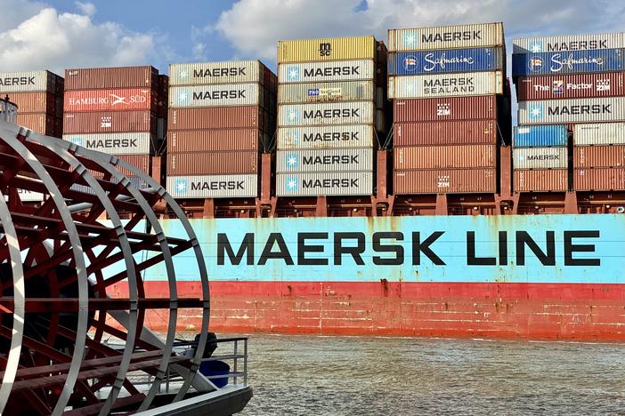 The container ship Adrian Maersk sails past the riverboat Georgia Queen on the Savannah River.