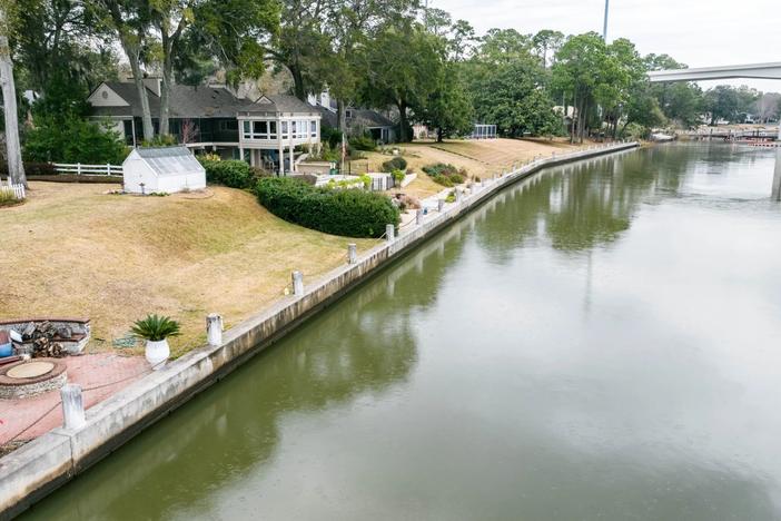 A bulkhead runs along the bank of the Intracoastal Waterway near the Causton Bluff Bridge. Credit: Justin Taylor/The Current