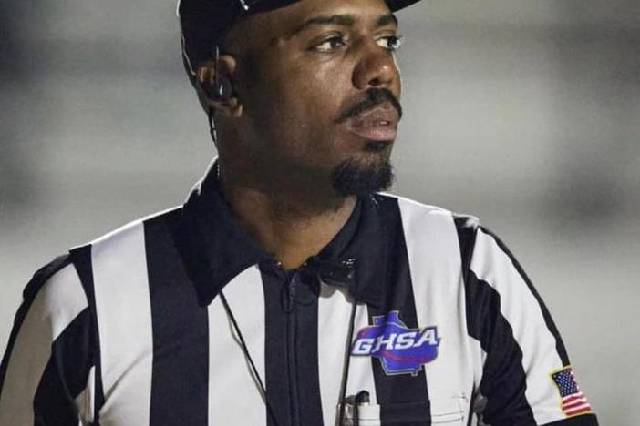 Darrius Stephens is shown in a referee's uniform.