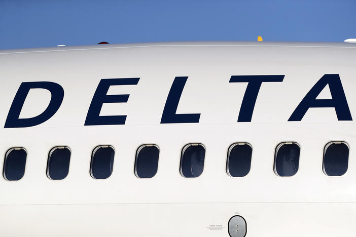  A Delta Air Lines jetliner is shown at Denver International Airport in Denver, June 26, 2019. Delta Air Lines is changing its employee uniform policy following a turbulent ride through a social media storm started by a passenger's outrage over two flight attendants photographed wearing Palestinian pins. 