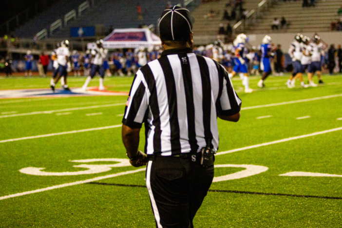 Referee at football game.