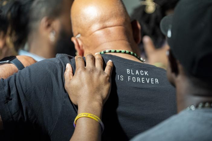 Attendees gather and pray during a Black Man Lab meeting to discuss the candidacy of Vice President Kamala Harris, Monday, July 22, 2024, in Atlanta. 