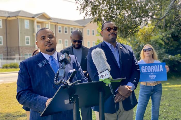 Georgia State Senator Derek Mallow, at left, speaks during a news conference in Savannah on Aug. 27, 2024, about Vice President Kamala Harris's housing affordability plans.