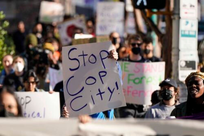 Demonstrators march to the courthouse supporting 61 defendants that are being arraigned on RICO charges related to vandalism at the site of the new Public Safety Training Center, outside the a Fulton County courthouse, Monday, Nov. 6, 2023, in Atlanta.