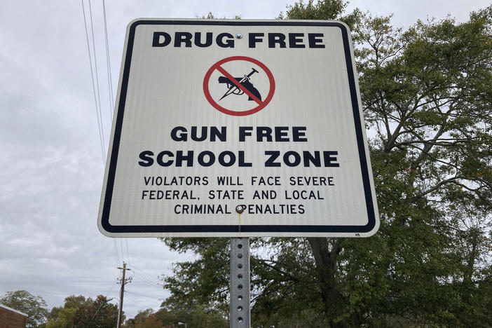 A sign warns of a gun-free school zone, Wednesday, Oct. 25, 2023, in Winder, Ga. Georgia Lt. Gov. Burt Jones says he wants to pay a $10,000 yearly stipend to teachers who pass firearms training, allowing them to carry guns in school. 