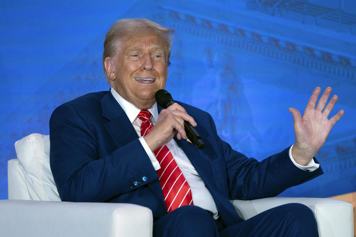 Republican presidential nominee former President Donald Trump speaks with Moms for Liberty co-founder Tiffany Justice during an event at the group's annual convention in Washington, Friday, Aug. 30, 2024.