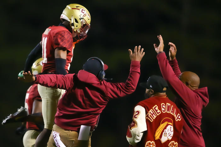 Creekside Seminoles celebrate a big play during their game.