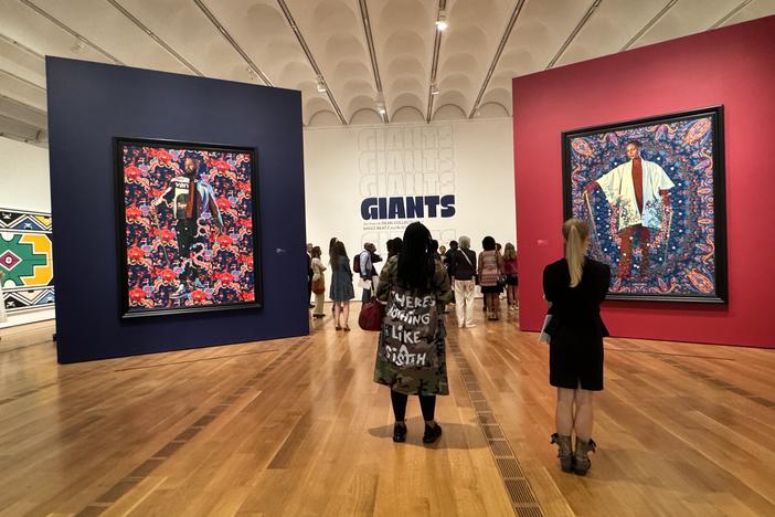 Patrons view the Giants exhibition at the High Museum on Sept. 13, 2024.